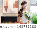A young bride smiles in a casual dress at a restaurant wedding. 143781188