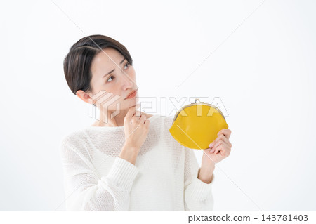 A thinking woman carrying a coin purse A thinking woman carrying a coin purse 143781403