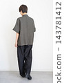 Full-body back view of a woman's fashion outfit. 143781412
