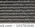 A gray, textured border. A background texture with coarse horizontal stripes. 143781646