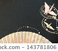 A pink fan and a Japanese-style background with origami cranes. 143781806