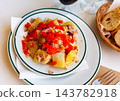 Potato salad with egg, canned tuna, onions, baked peppers and olives 143782918