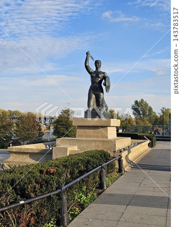 Warsaw, Poland - October 5, 2026: Warsaw Mermaid monument beside riverside steps Warsaw, Poland - October 5, 2026: Warsaw Mermaid monument beside riverside steps 143783517