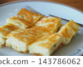 Slices of freshly baked cheese turkish borek pastry, neatly arranged and served on a plate 143786062