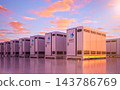 Group of energy storage systems or battery container units with sunset sky background 143786769