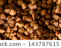 Organic buckwheat grains background texture pattern 143787615