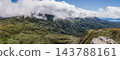 Green valleys around Mount Nyuto and white clouds hanging over the mountains 143788161