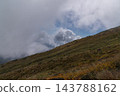 Autumn grasslands on Mount Chokai and rising white clouds 143788162