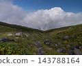 The rocky, grassy valleys of Mount Chokai and rising clouds 143788164