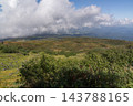 The slopes of Mount Chokai in early autumn, with a distant view visible through the clouds. 143788165