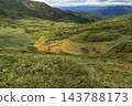 Autumn foliage and ponds spread across the green valleys around Mt. Nyuto 143788173