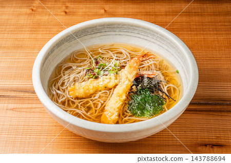 "Ebi-ten Kake Udon/Soba" is a dish featuring a large shrimp tempura in a warm broth. "Ebi-ten Kake Udon/Soba" is a dish featuring a large shrimp tempura in a warm broth. 143788694