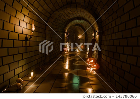 Halloween brick tunnel with glowing jack o lantern pumpkins, burning torches, candles, skulls and skeleton, 3D illustration of a spooky underground dungeon Halloween brick tunnel with glowing jack o lantern pumpkins, burning torches, candles, skulls and skeleton, 3D illustration of a spooky underground dungeon 143790060