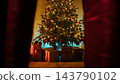 Christmas Tree With Presents Viewed Between Curtains 143790102