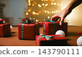 Hand Selecting Christmas Gift Among Presents 143790111