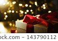 Close Up Christmas Gift Box With Red Ribbon Bokeh Lights 143790112