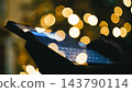 Man At Home During Christmas Chatting With His Tablet 143790114