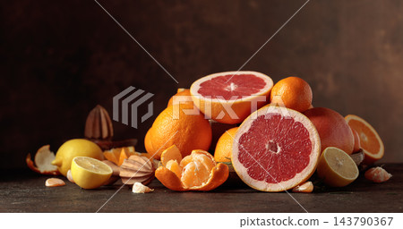 Citrus fruits on a old brown table. 143790367
