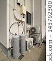 Propane gas cylinders and air conditioner outdoor units in residential buildings 143792300