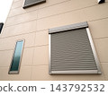 Window shutters on the exterior walls of houses 143792532