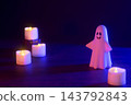 Halloween image with ghosts and candles (using colored lights and filters) 143792843