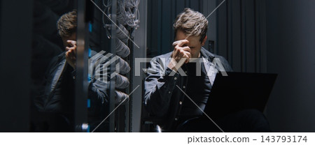 Frustrated Male Network Engineer Losing His Temper While Facing Critical Server Failure Frustrated Male Network Engineer Losing His Temper While Facing Critical Server Failure 143793174