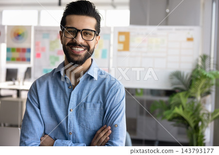 Headshot portrait of happy young Pakistani businessman posing for photo Headshot portrait of happy young Pakistani businessman posing for photo 143793177