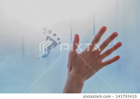 Waiting for Baby: Hand and Footprint on Misty Window Glass Waiting for Baby: Hand and Footprint on Misty Window Glass 143793410