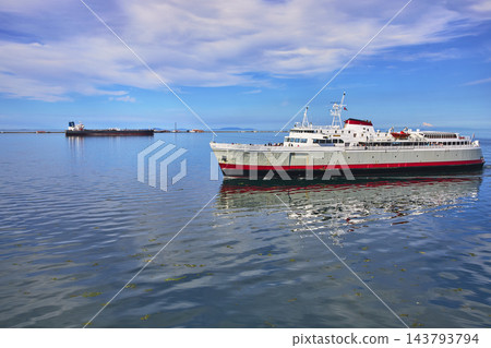 Ferry Ship on Blue Water Near Port Angeles Washington Under Vibrant Summer Sky Ferry Ship on Blue Water Near Port Angeles Washington Under Vibrant Summer Sky 143793794