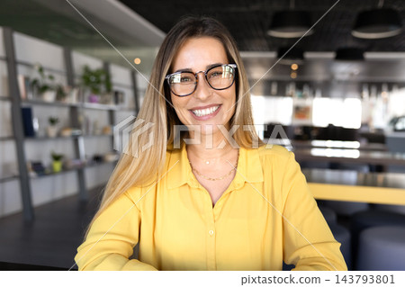Head shot portrait of smiling professional woman looking at camera Head shot portrait of smiling professional woman looking at camera 143793801
