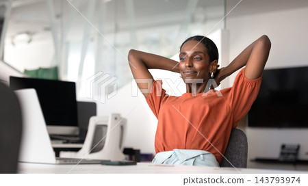 African business woman relaxing in modern office African business woman relaxing in modern office 143793974