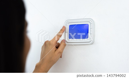 Close up of smart home thermostat control panel Close up of smart home thermostat control panel 143794002