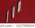 Wooden matchsticks arranged in a progressive ascending order on red. 143794024