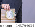 Stack Of Textbooks With One Euro Coin Representing Education Costs, Student Finance And Investment 143794034
