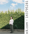 A cute woman who is 8 months pregnant 143795281