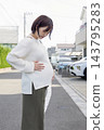 A cute woman who is 8 months pregnant 143795283