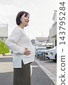 A cute woman who is 8 months pregnant 143795284