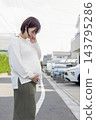 A cute woman who is 8 months pregnant 143795286