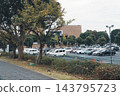 The old cherry trees were cut down, creating an open walking path and the parking lot of Hachioji City Hall. 143795723