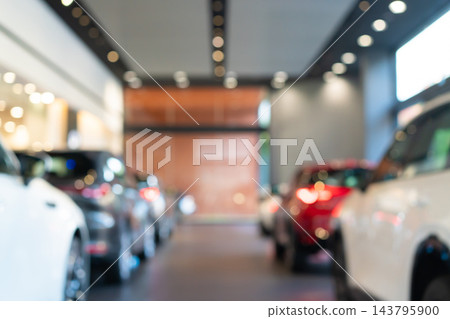 blur view of new modern car in showroom blur view of new modern car in showroom 143795900