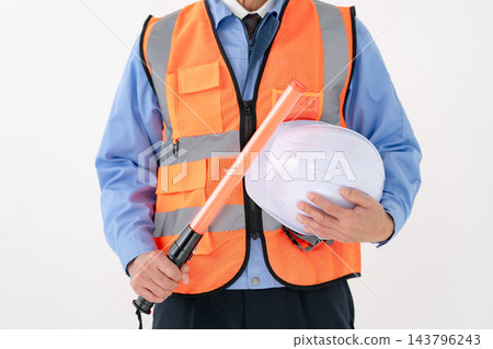 Reflective vest, traffic wand, worker, handheld Reflective vest, traffic wand, worker, handheld 143796243