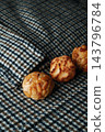 pine nut and coconut panellets on checked fabric 143796784
