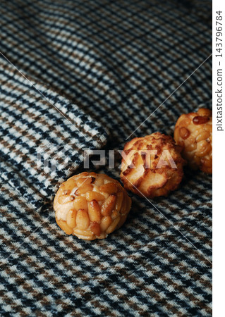 pine nut and coconut panellets on checked fabric pine nut and coconut panellets on checked fabric 143796784