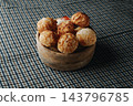 assorted Catalan panellets in a wooden bowl 143796785