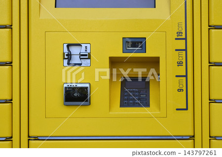 Payment terminal interface on a yellow parcel locker station Payment terminal interface on a yellow parcel locker station 143797261