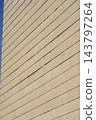 Concrete tower facade with linear textured surface details 143797264