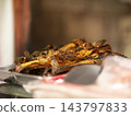 Deep fried Indonesian catfish or lele goreng served on a tray at a local street food vendor in East Java 143797833