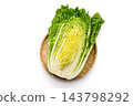 Cross-section of a cabbage cut lengthwise 143798292