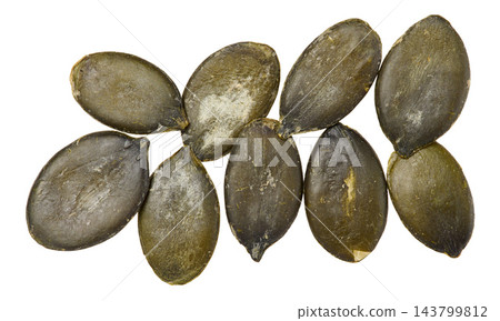 Shelled pumpkin seeds on an isolated background Shelled pumpkin seeds on an isolated background 143799812