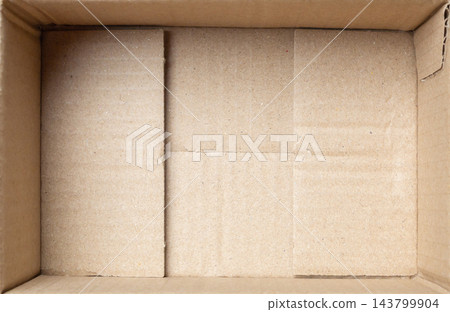 Open empty brown cardboard box background top view Open empty brown cardboard box background top view 143799904